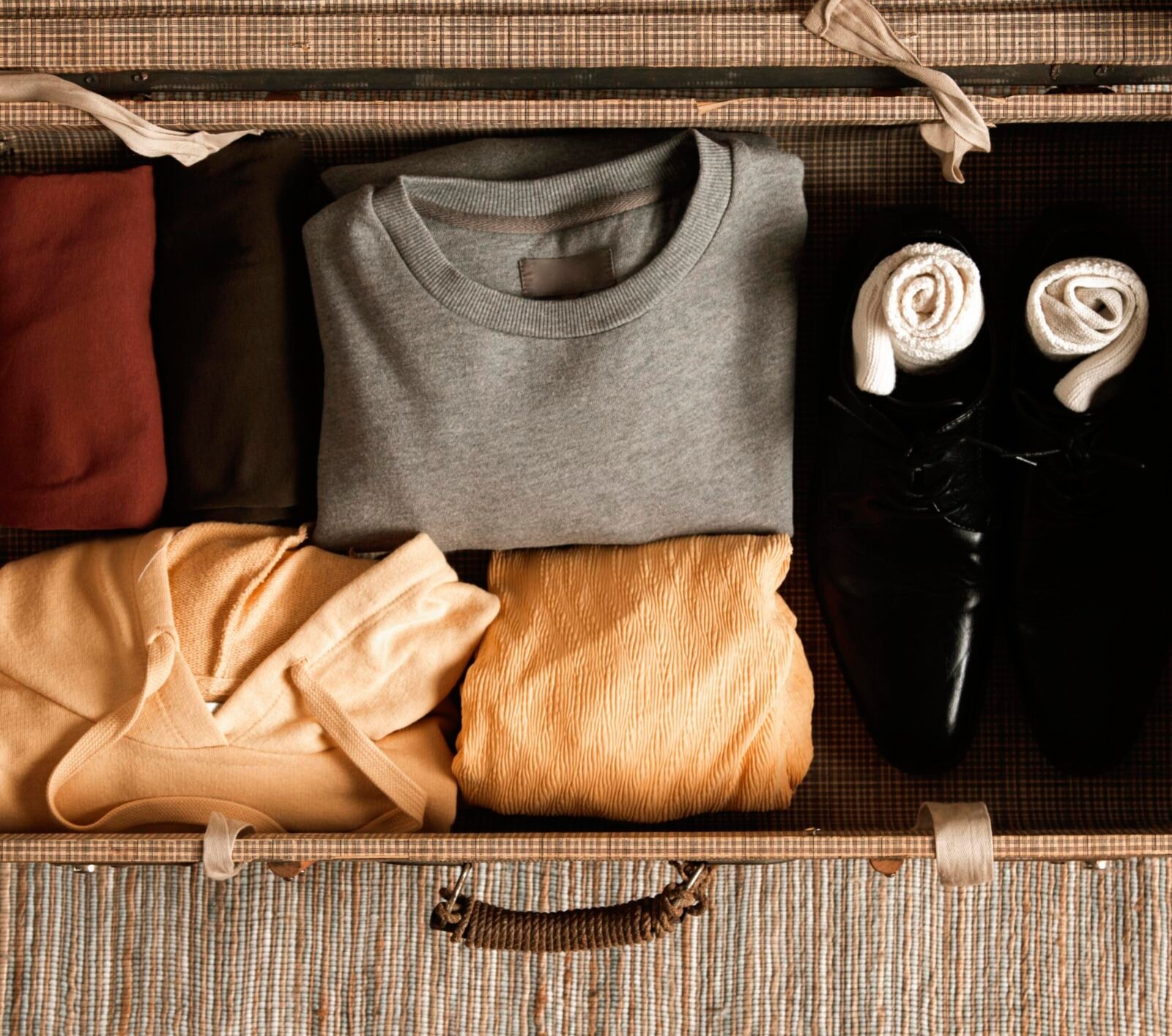 top-view-vintage-suitcase-with-casual-clothes